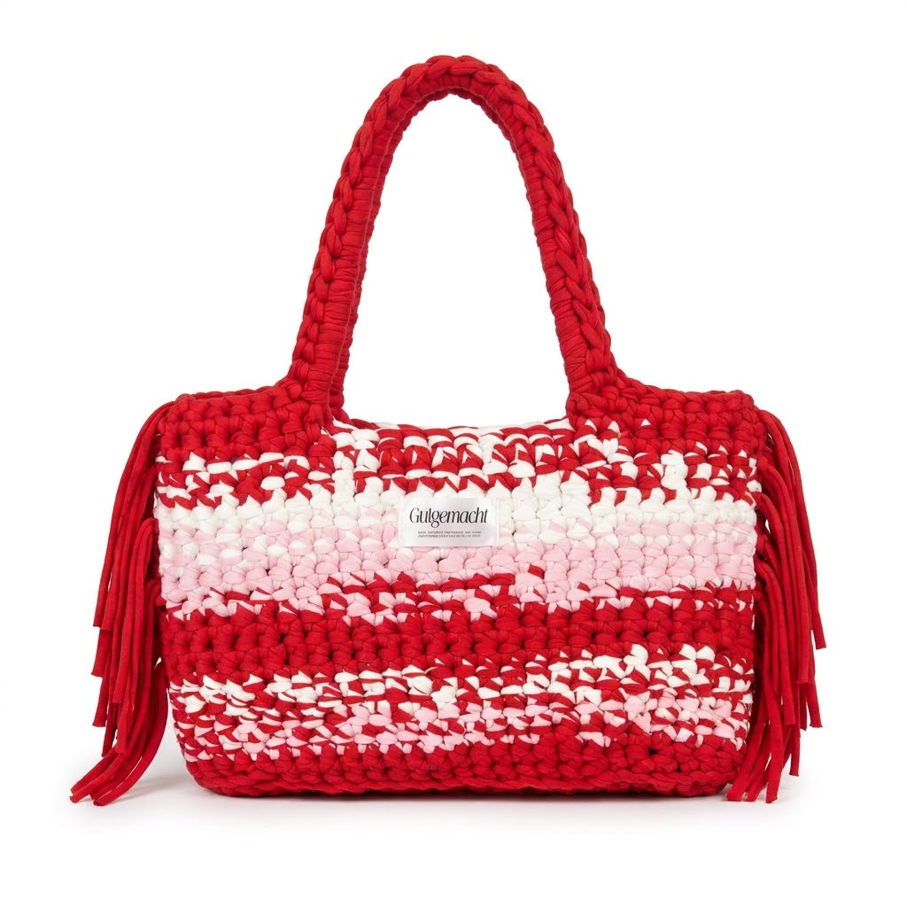 Rot-rosa gemusterte handgemachte Clutch mit Fransen – einzigartige gehäkelte Tasche aus der Schweiz von Gutgemacht