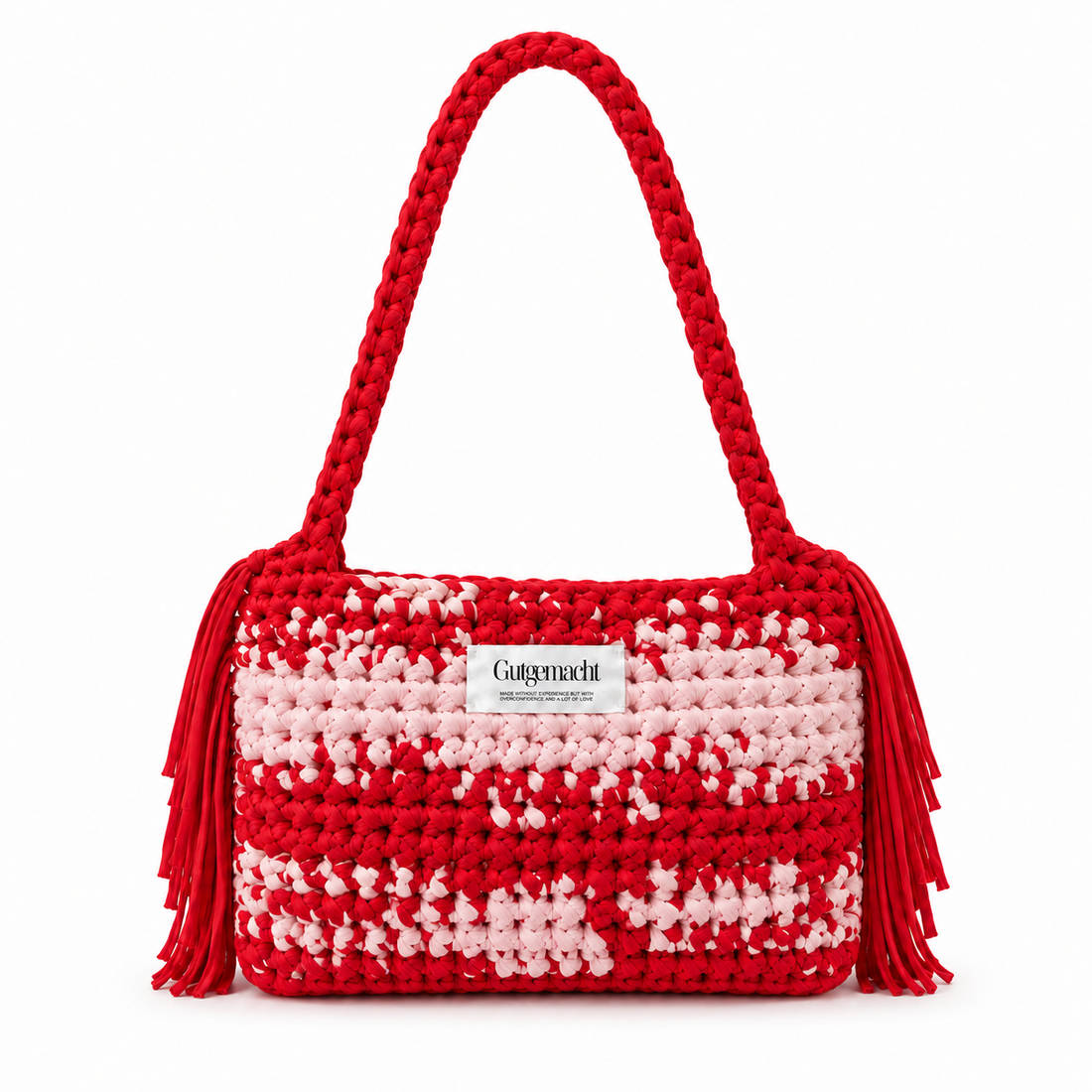 Rot-rosa gemusterte handgemachte Clutch mit Fransen – einzigartige gehäkelte Tasche aus der Schweiz von Gutgemacht